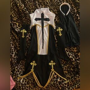 Black and White Costume with Gold Cross Accents